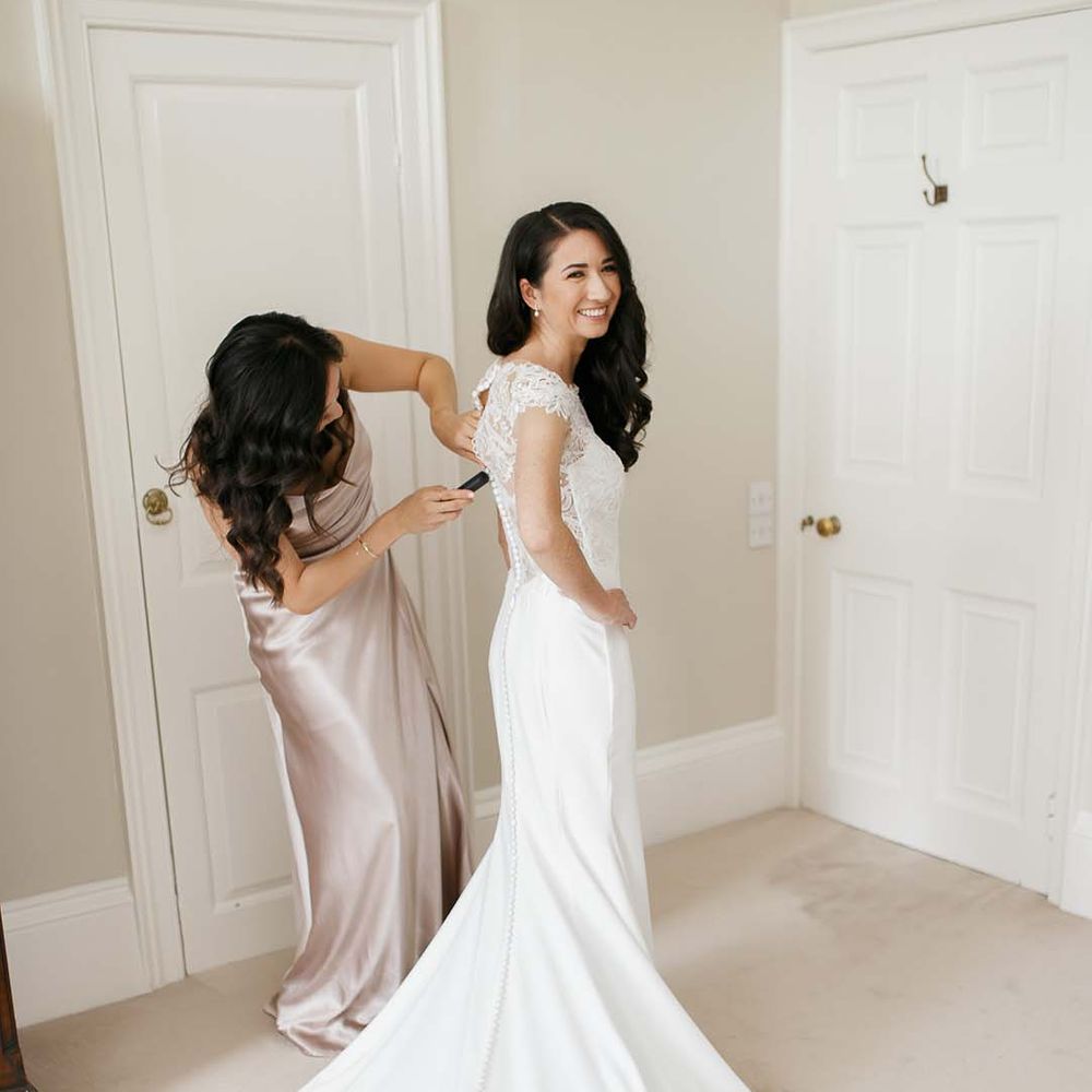 Wedding morning bridal preparations with bride in a Kelly Faetanini wedding dress