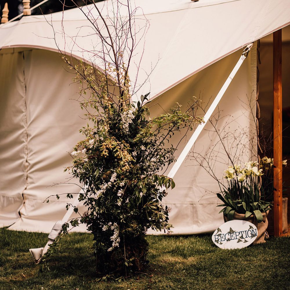 Foliage wedding flower column at marquee wedding for at home wedding 