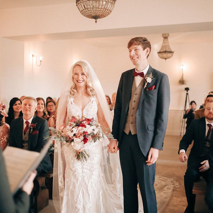 Romantic civil ceremony with bride and groom at red and white theme wedding 