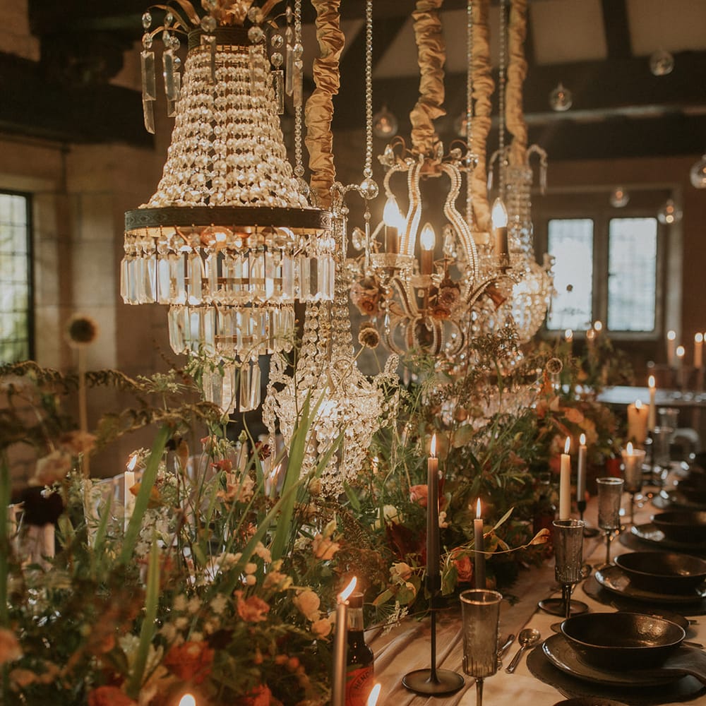 Chandelier and candle light wedding table decor 