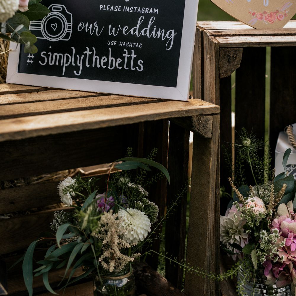 Chalkboard wedding signage on wooden box 