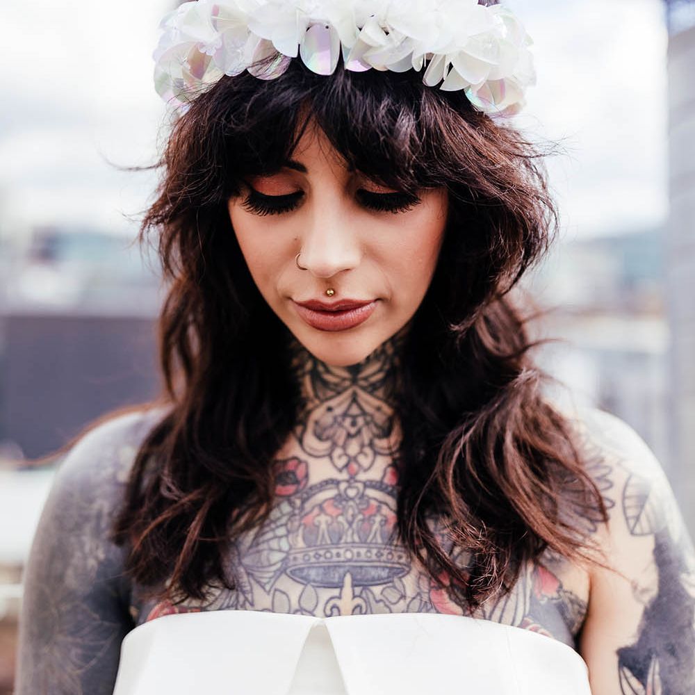 Bride with a fringe wearing an appliqué alternative wedding headband 