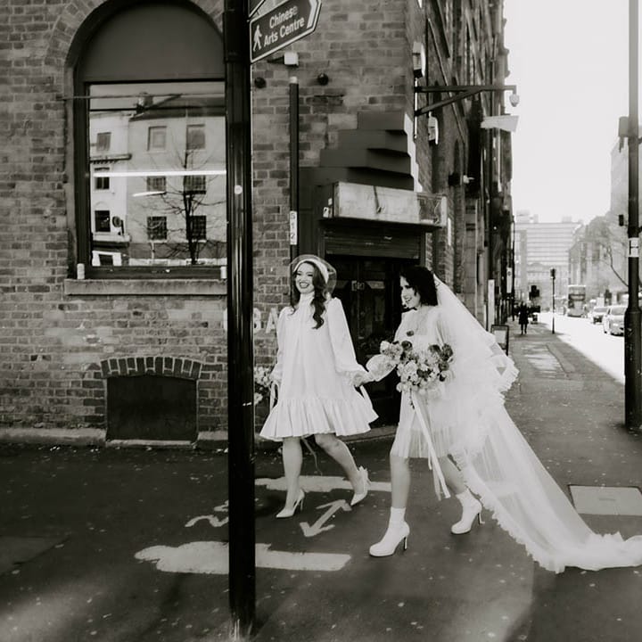 Manchester elopement with brides in short wedding dress long veil and berret combo 