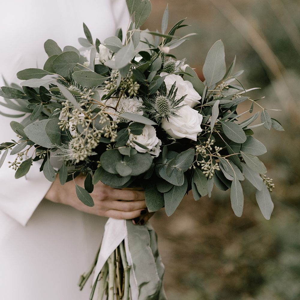 Sage green fauna and white rose floral bouquet 