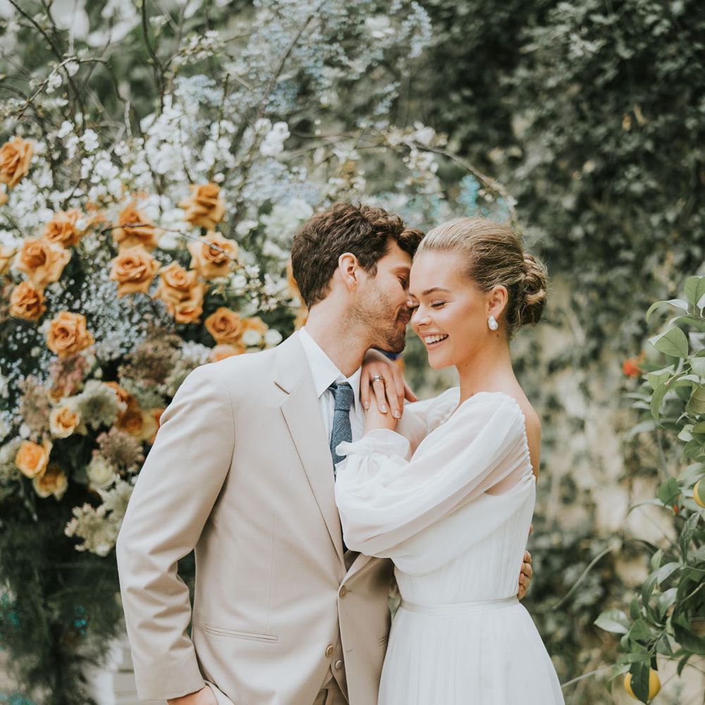 Bride and groom laugh together and share a special moment