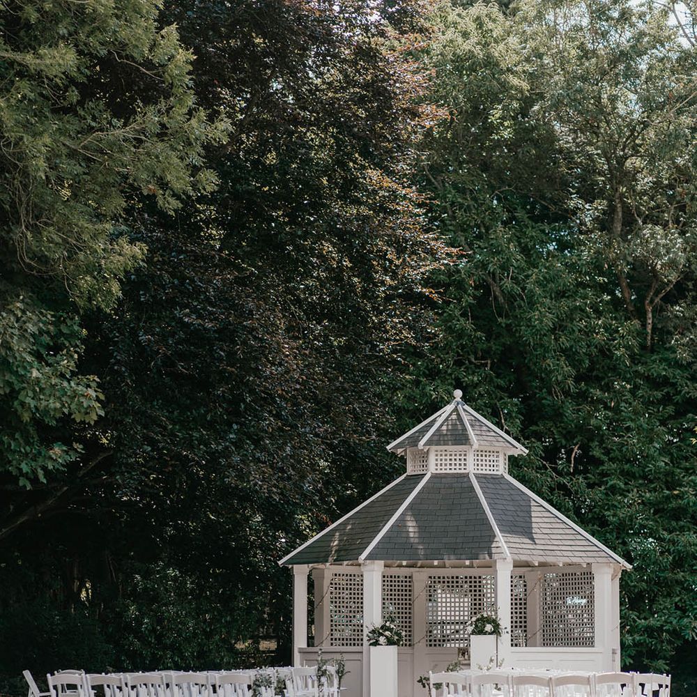 White gazebo outdoor wedding ceremony space at Hayne House wedding venue 