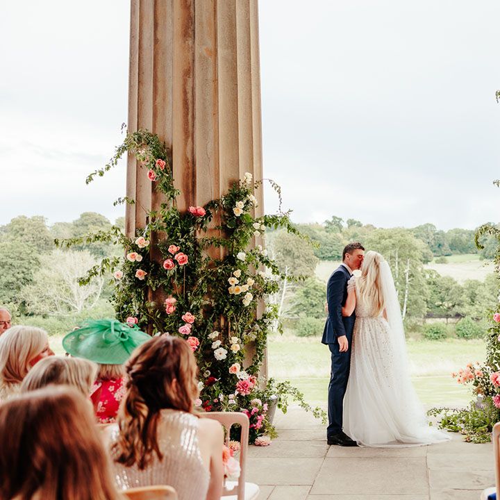 The Grange in Hampshire wedding venue with pink wedding flower column arrangements 