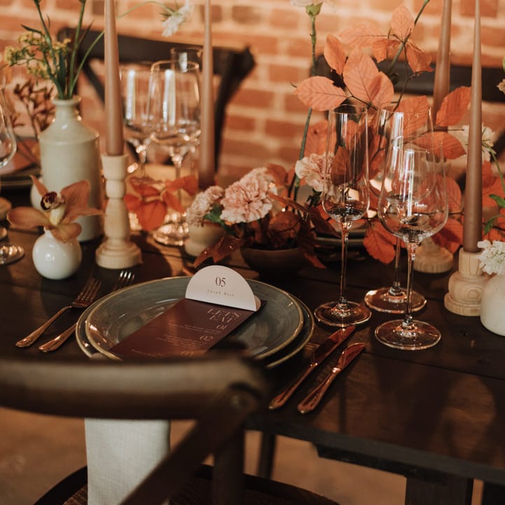 Floral tablescape setting for rustic wedding at Reymerston Hall