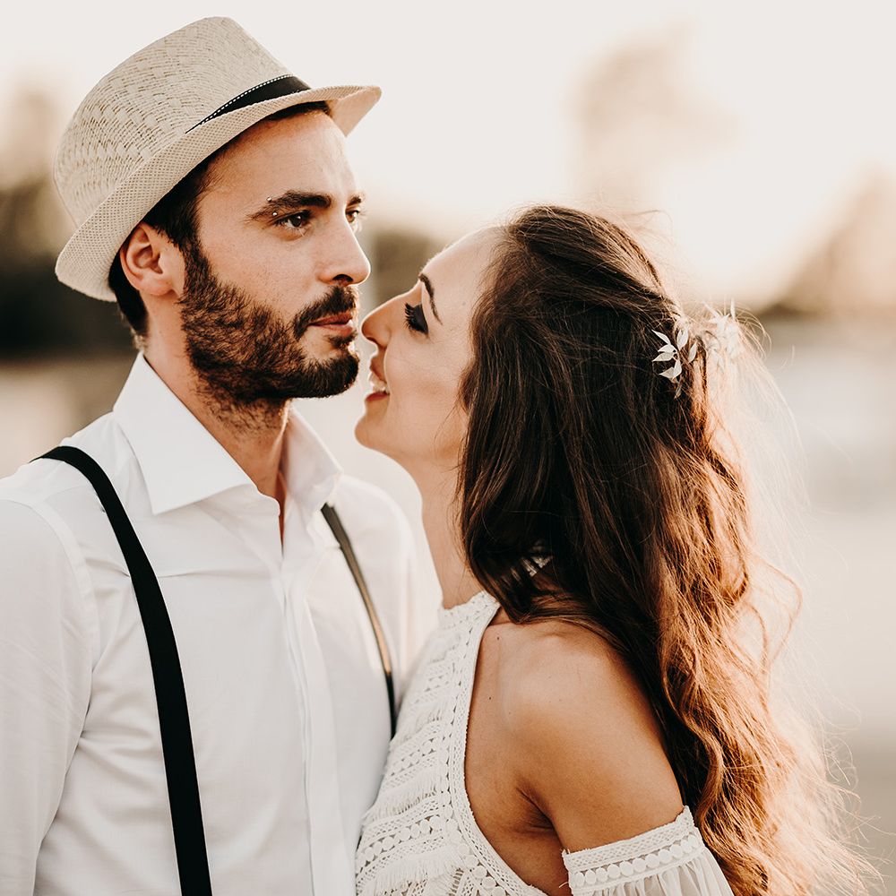 Groom in straw hat for destination wedding in Italy