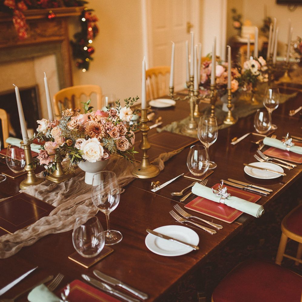 Elegant tablescape with stag napkin rings and gold candlesticks 