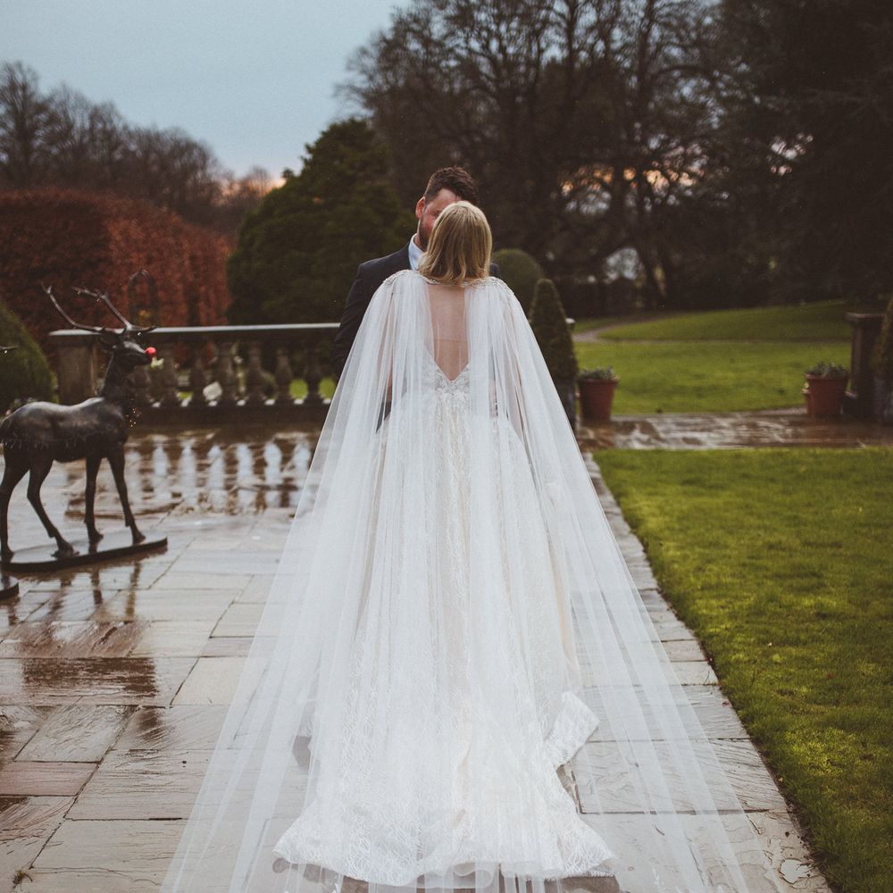 Bespoke bridal cape with lace detail 