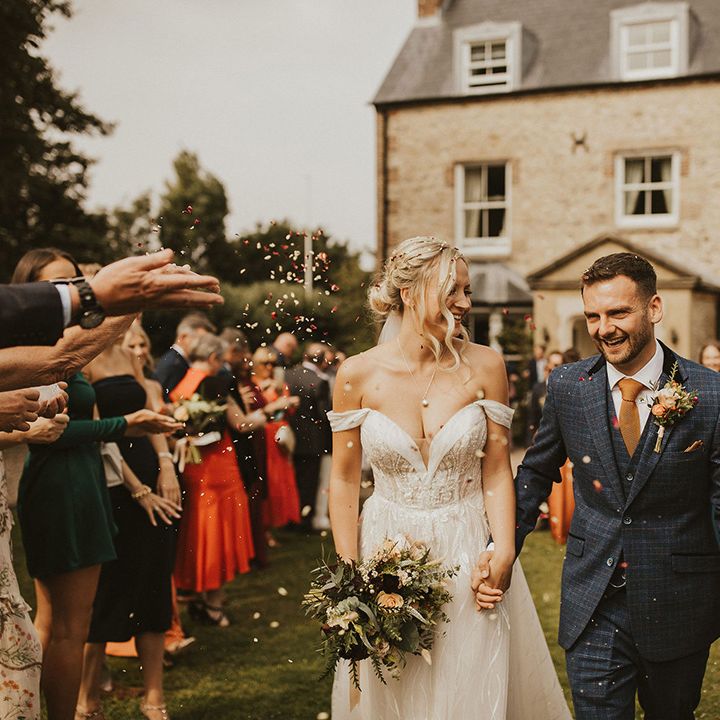 Confetti moment for bride and groom at East Afton Farmhouse 