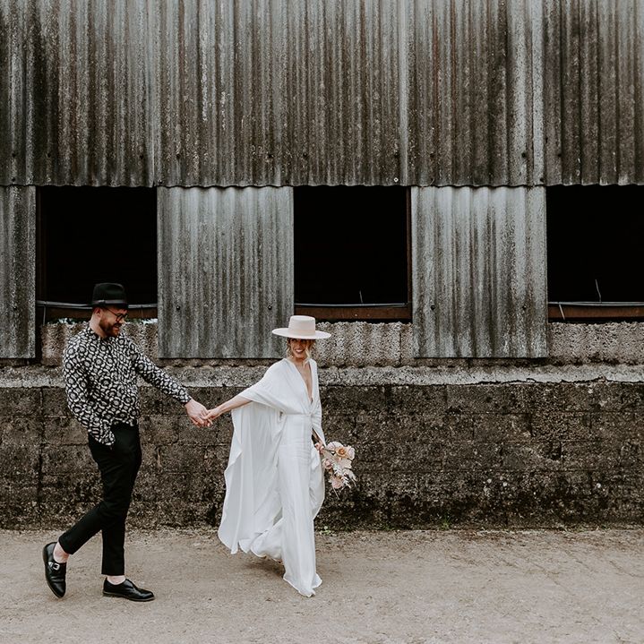 Bride & groom walk with one another on their wedding day