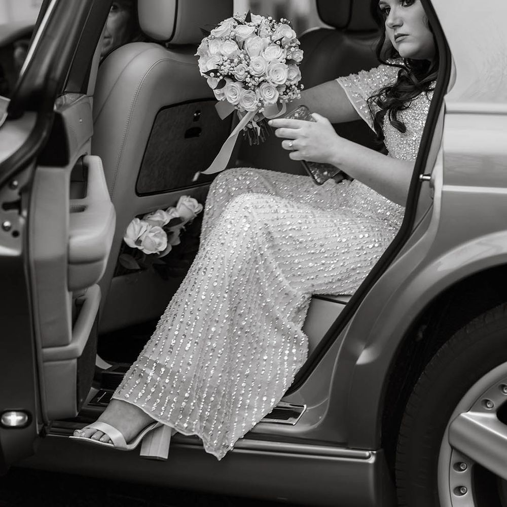 Bride leaves car on her wedding day