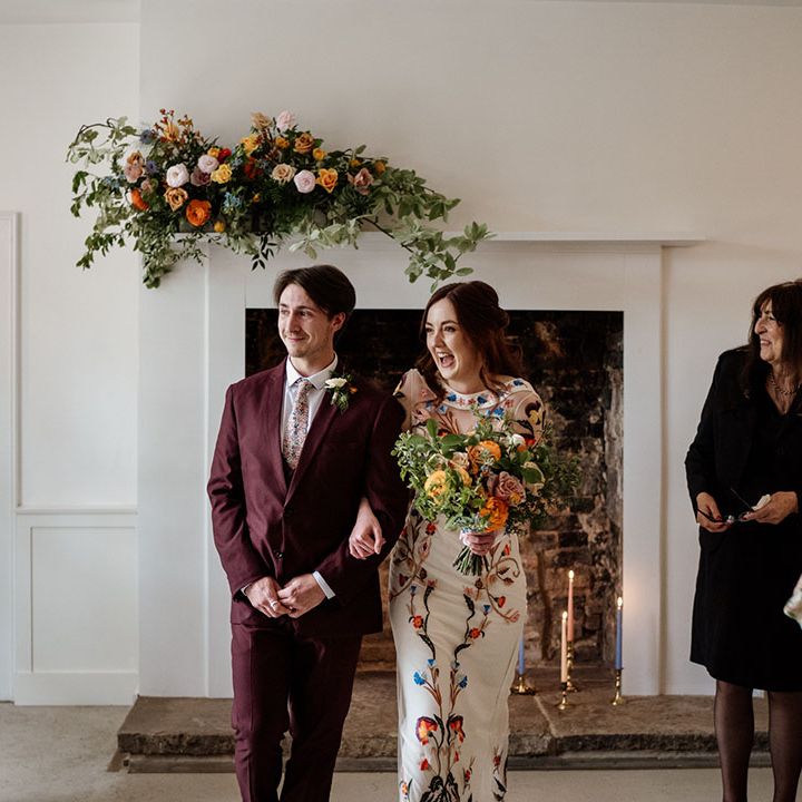 Bride and groom walk back down the aisle as husband and wife 