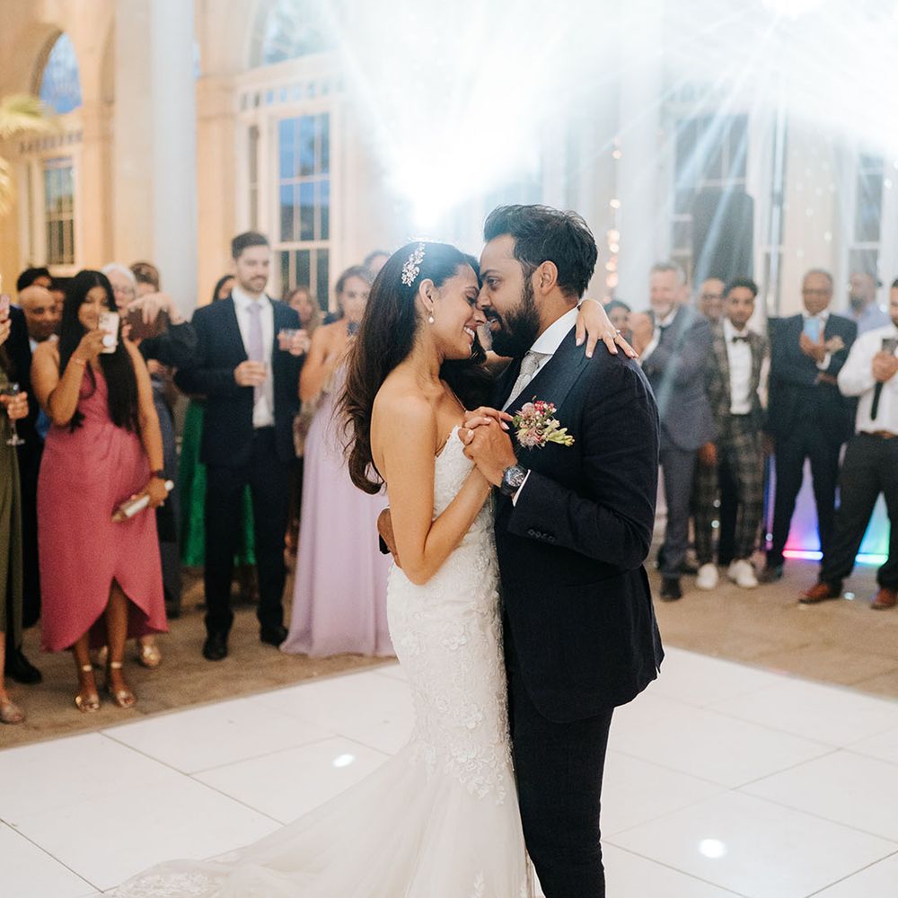 Bride & groom have their first dance during wedding reception at the Great Conservatory in Syon Park 