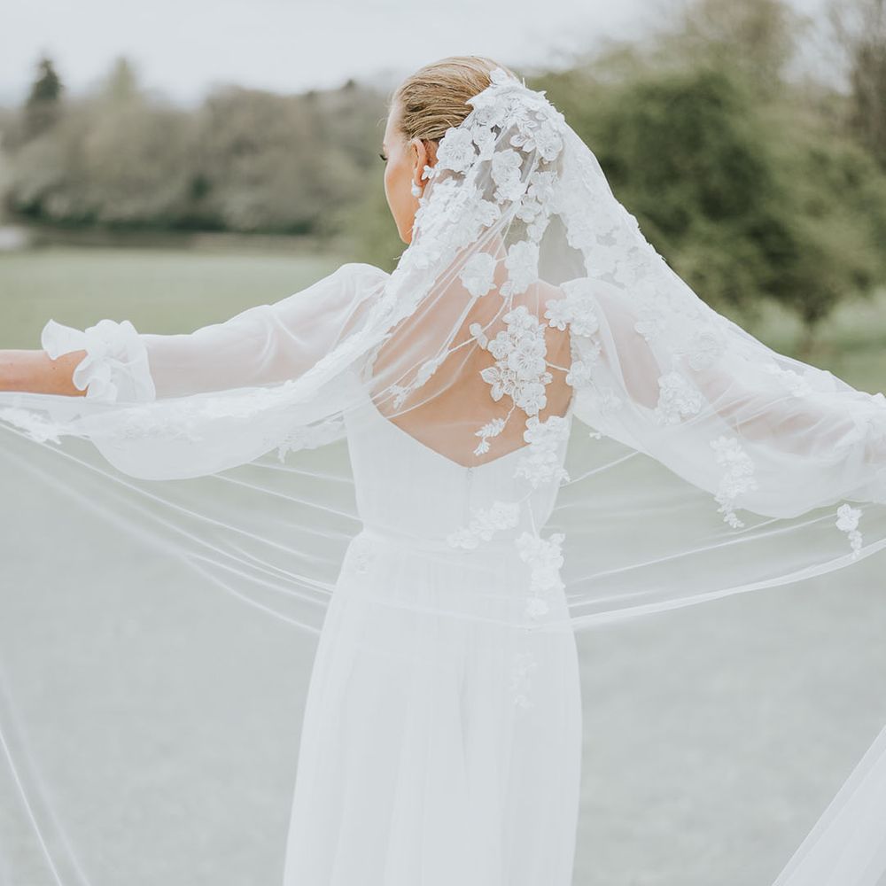 Bride wearing a flower wedding veil 