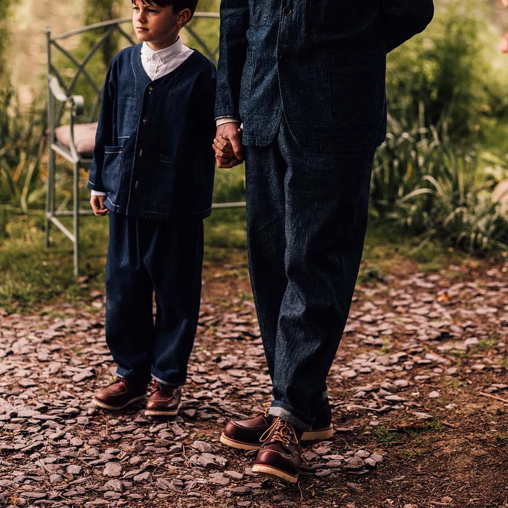Groom and son in matching double denim suits for the relaxed outdoor wedding 