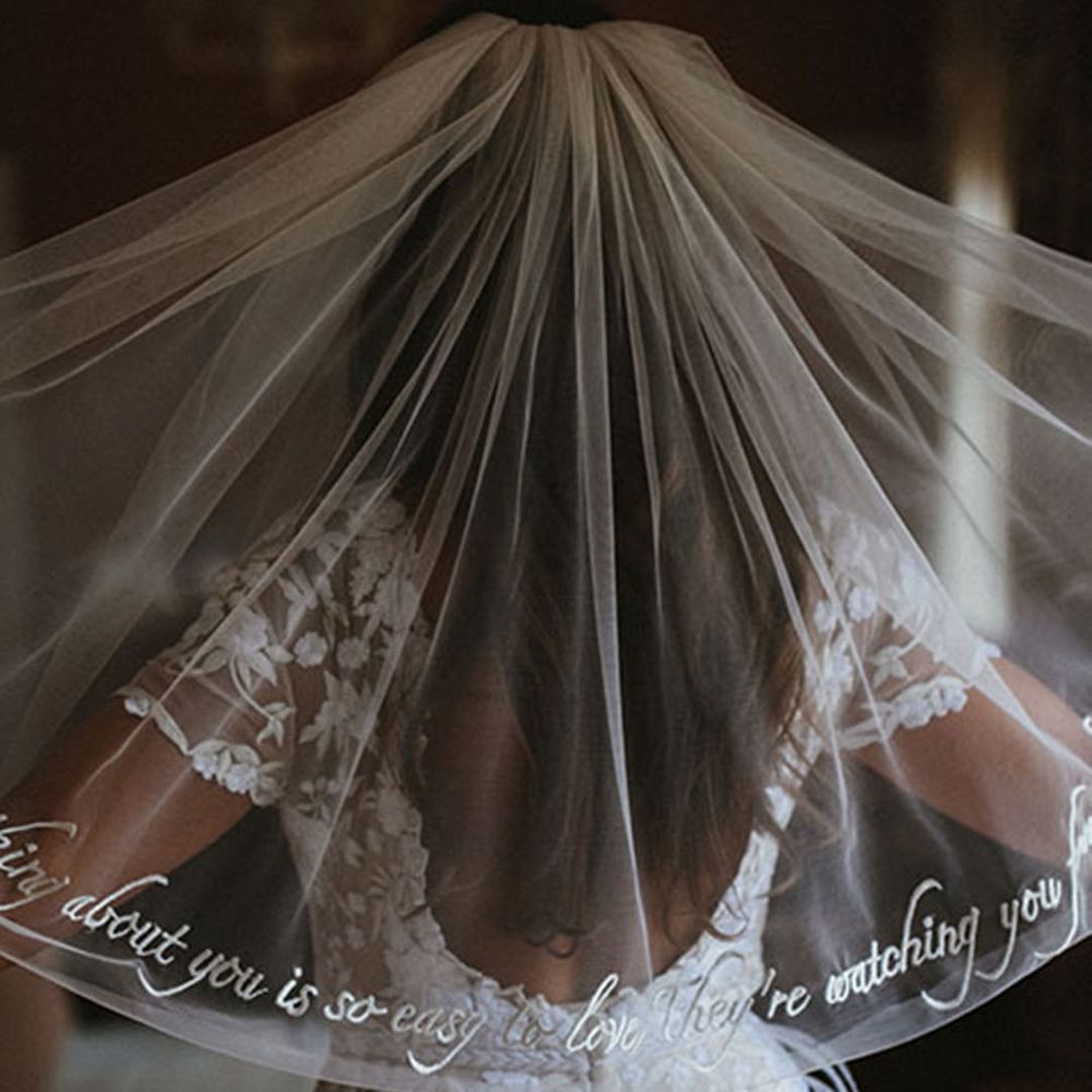 living floral runners for marquee wedding with bride in hermione de paula james frost photography