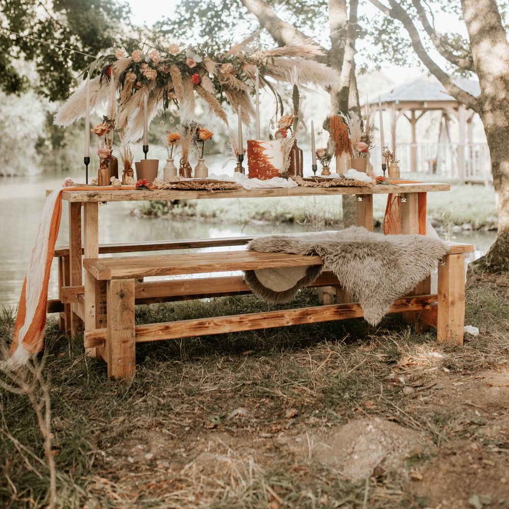 Boho chic outdoor table decor with Autumnal colour scheme and pampas grass arch 