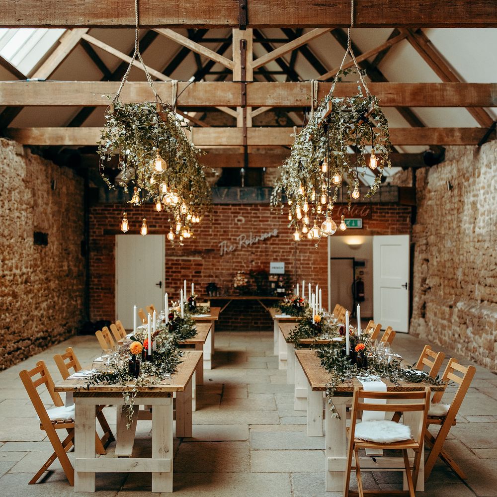 Rustic wedding venue with hanging ivy and lighting
