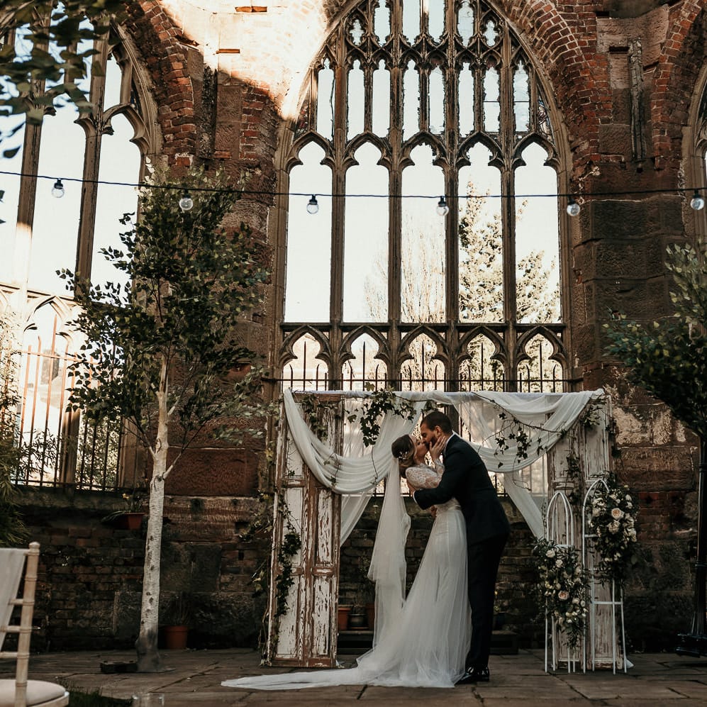 Trees and shabby door wedding altar decor at the bombed out church in Liverpool 