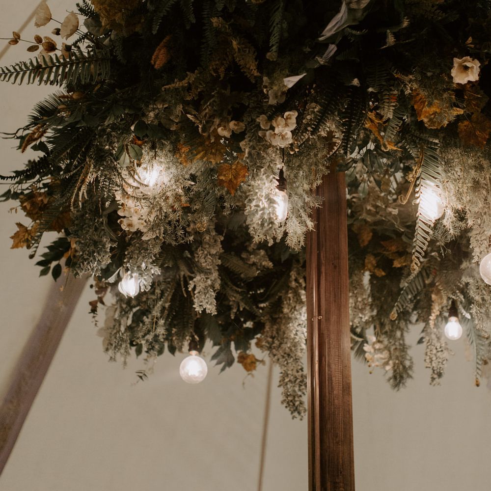 Florals complete with festoon lighting within