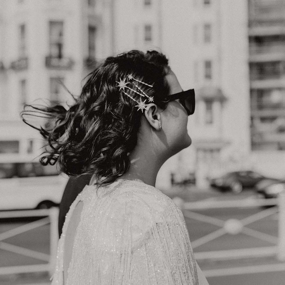 Bride wears star hair accessories holding her hair back