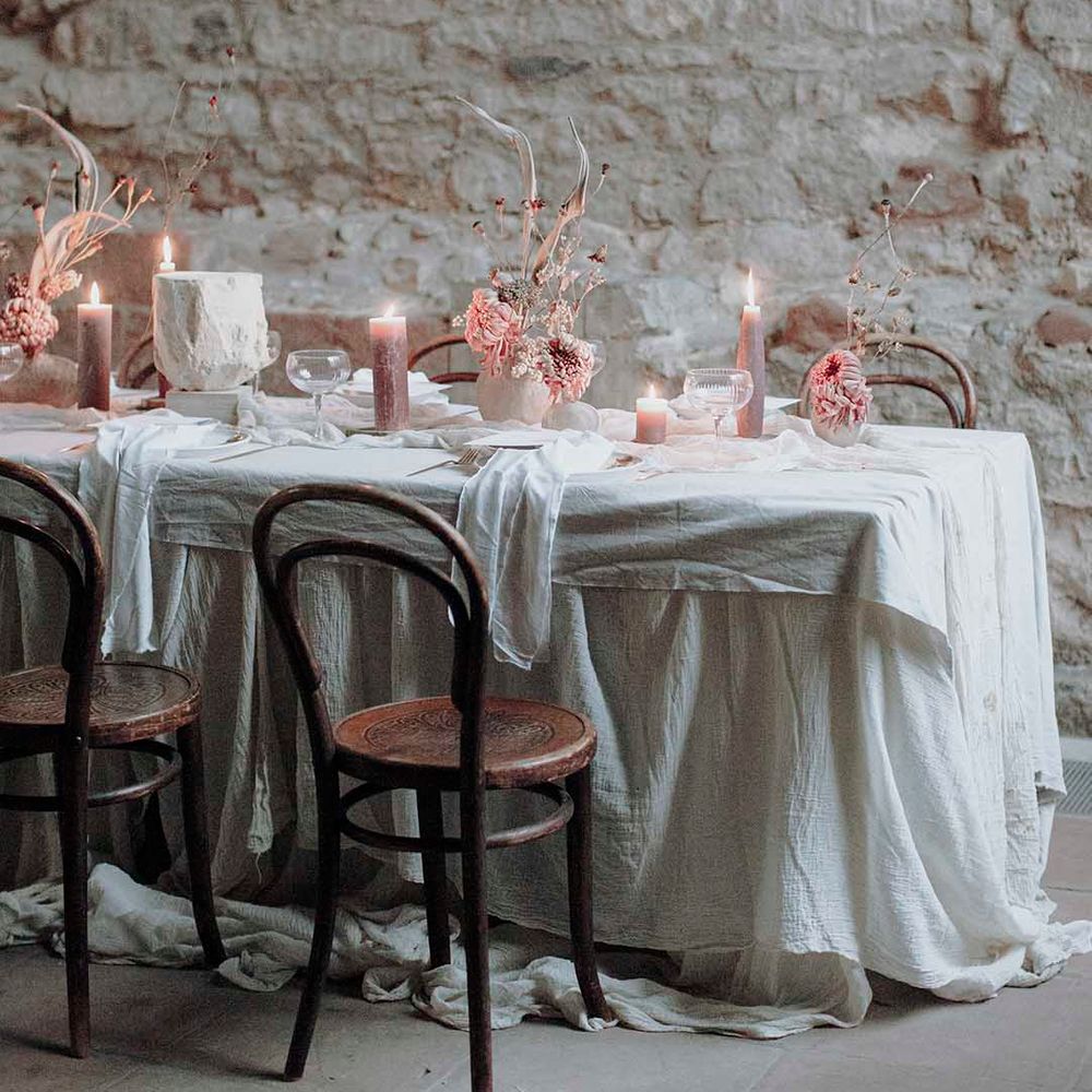 Blackfriars Priory wedding table decor with blush pillar candles and flowers 