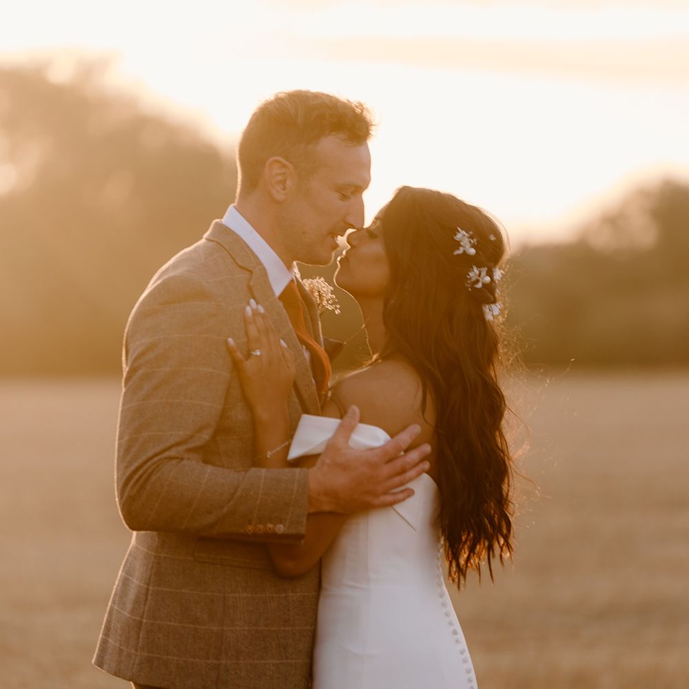 Bride and groom embrace for their couple portraits 