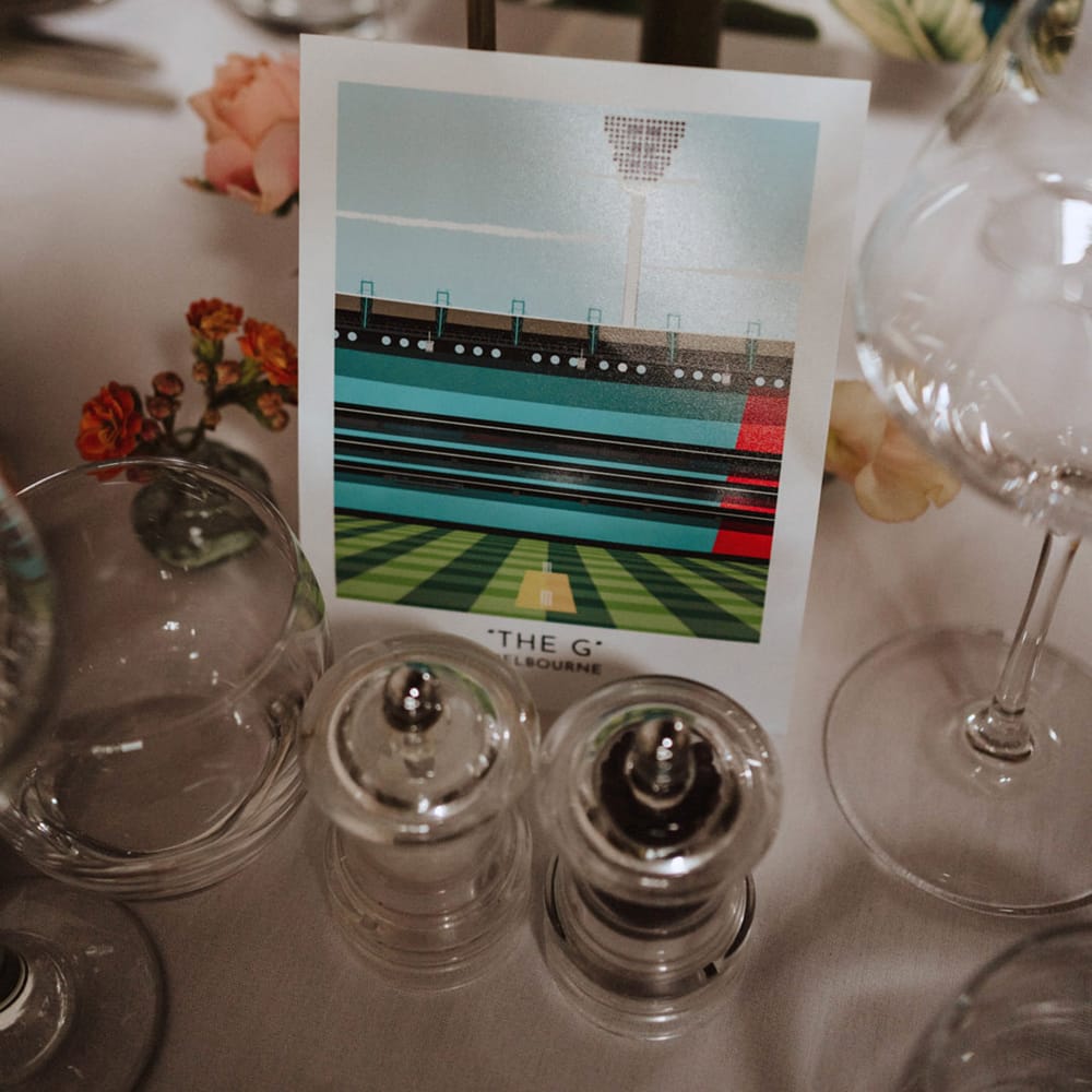 Stadium picture table name signs idea with dark green table decoration theme 