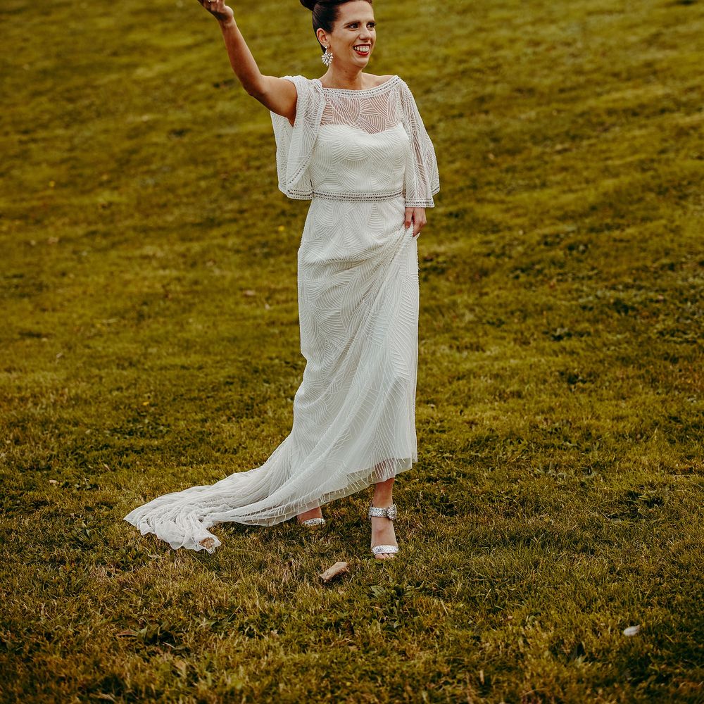 Bride walks through grounds with smoke bomb 