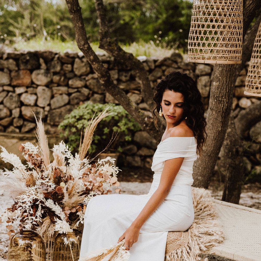 Bride wearing off the shoulder white bridal gown