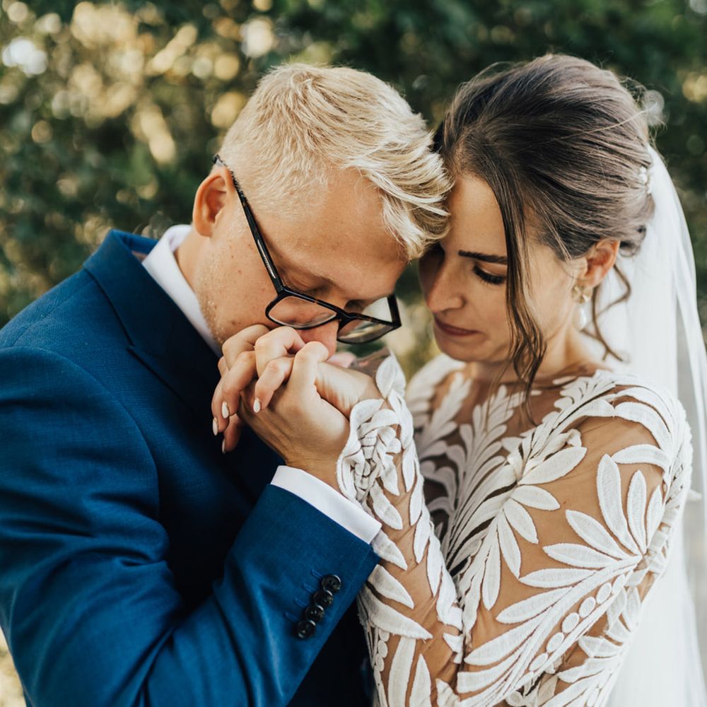 Boho Bride & Groom hold hands at unplugged ceremony 