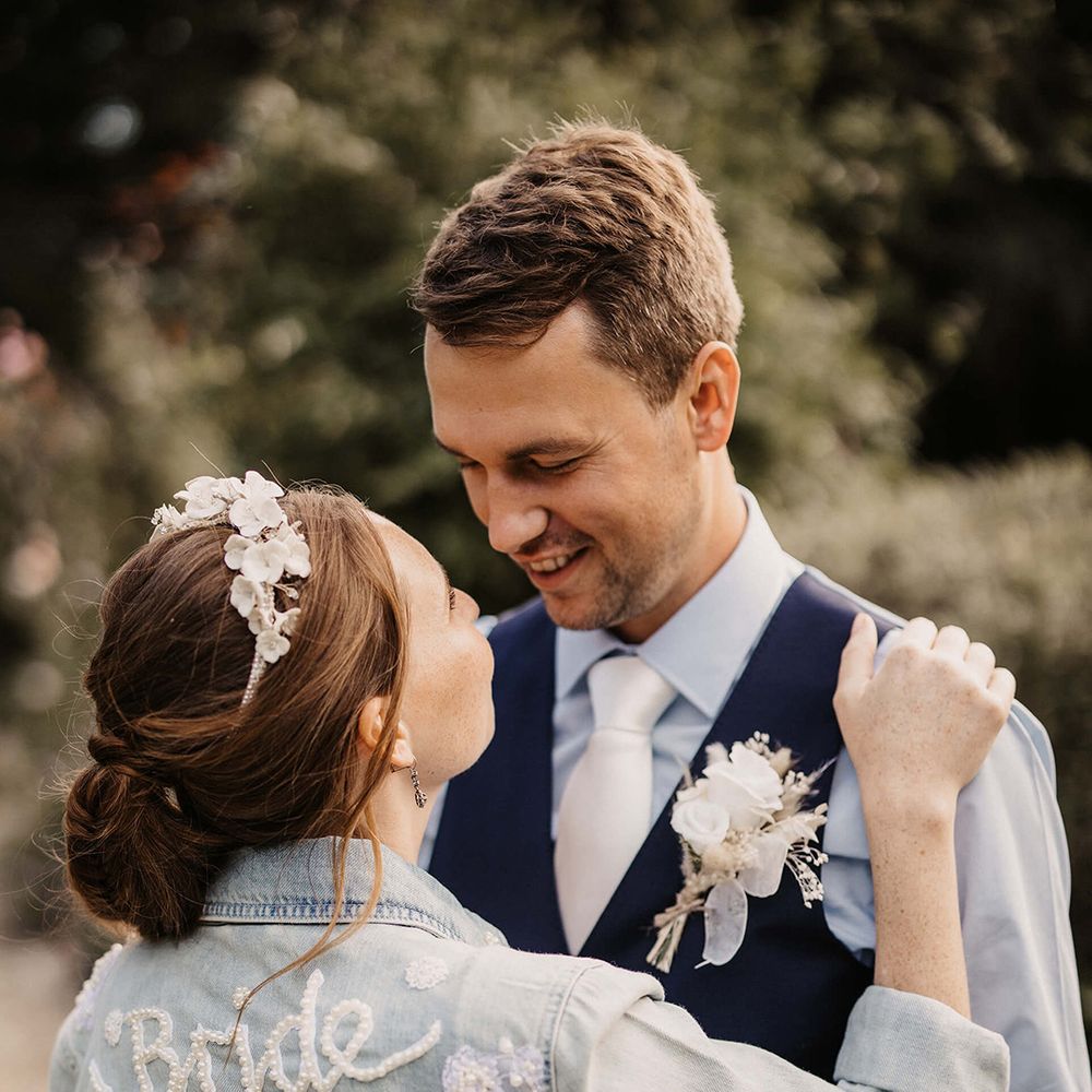 Bride & groom look lovingly at one another on their wedding day