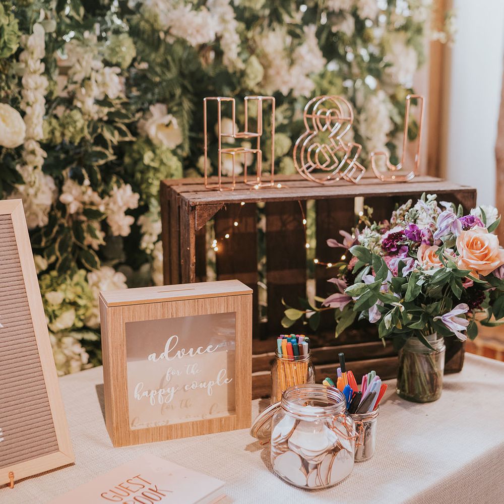 Wedding guest book and advice box for the bride and groom with wooden crates and personalised wired initial sign 