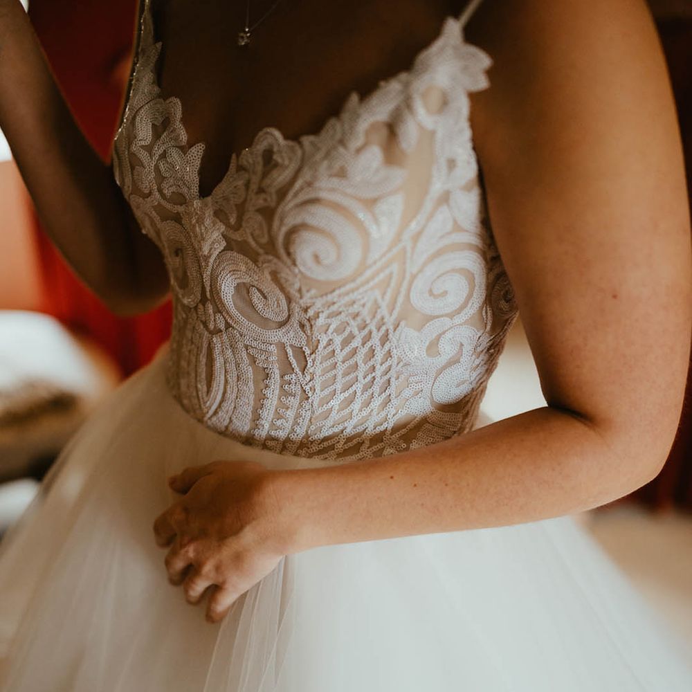 Pretty sequin top detail with tulle skirt wedding dress by Blush by Hayley Paige 