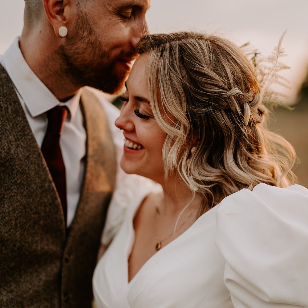 Bride wears a wedding gown with short puff sleeves 
