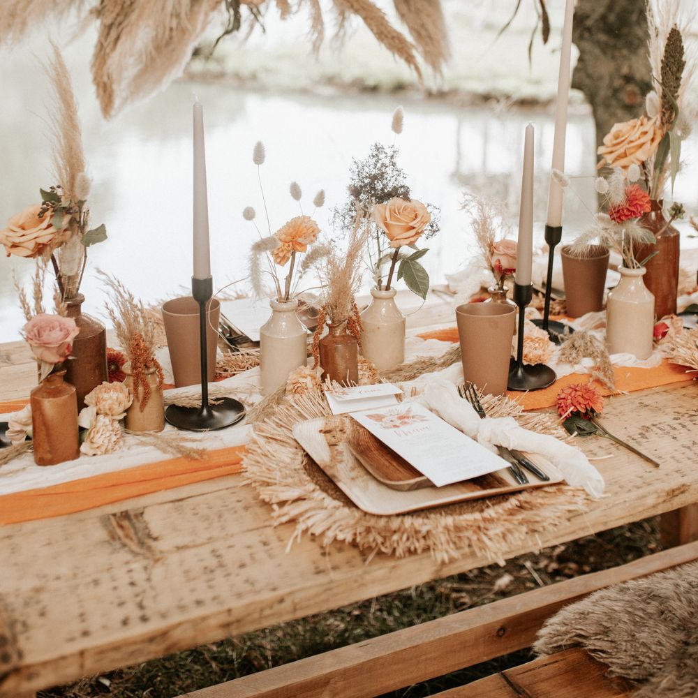 Boho chic outdoor table decor with Autumnal colour scheme and pampas grass arch 
