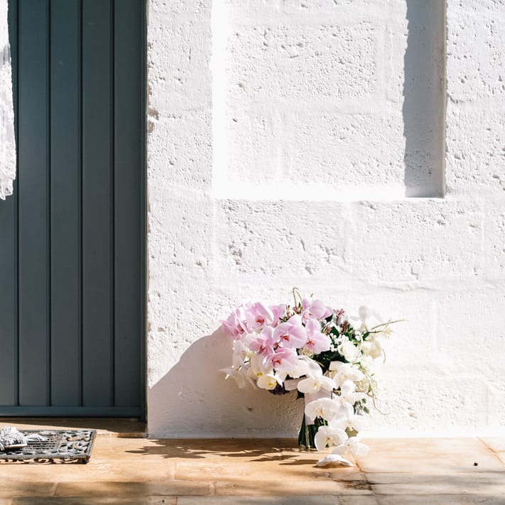 Bridal dress, shoes and bouquet outside for country style Italian wedding