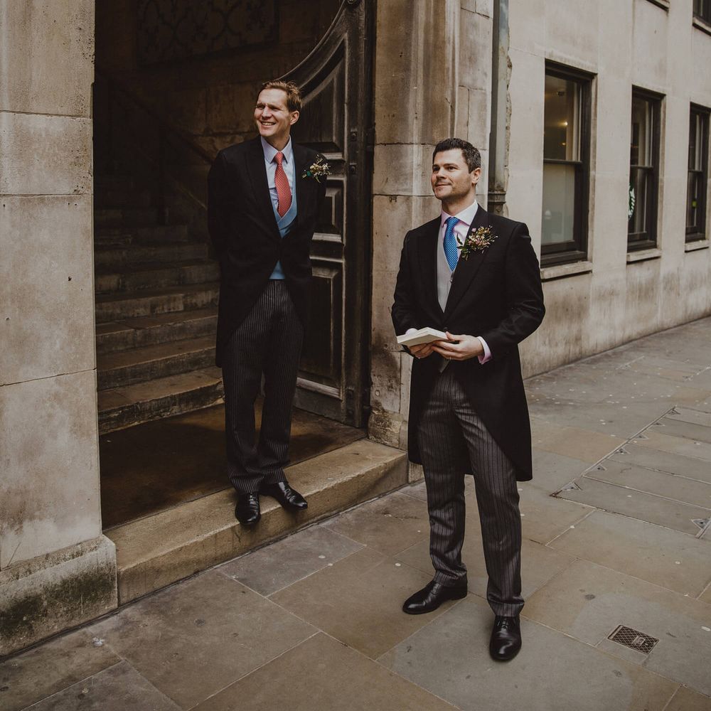 Groomsmen waiting outside London Church 