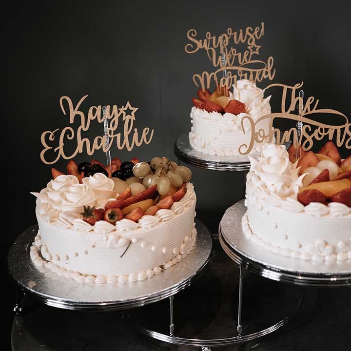 Single tier fresh cream wedding cake with fresh colourful fruit 