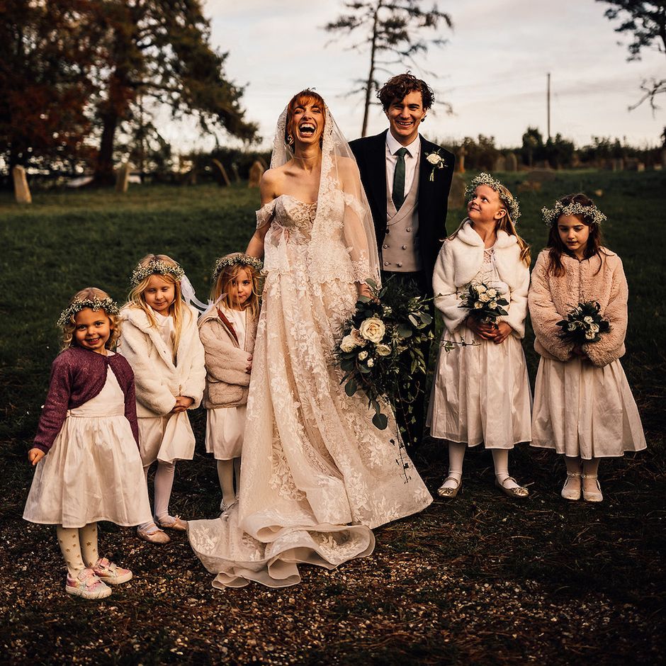 Bride and groom with their flower girls at winter wedding at Oxnead Hall