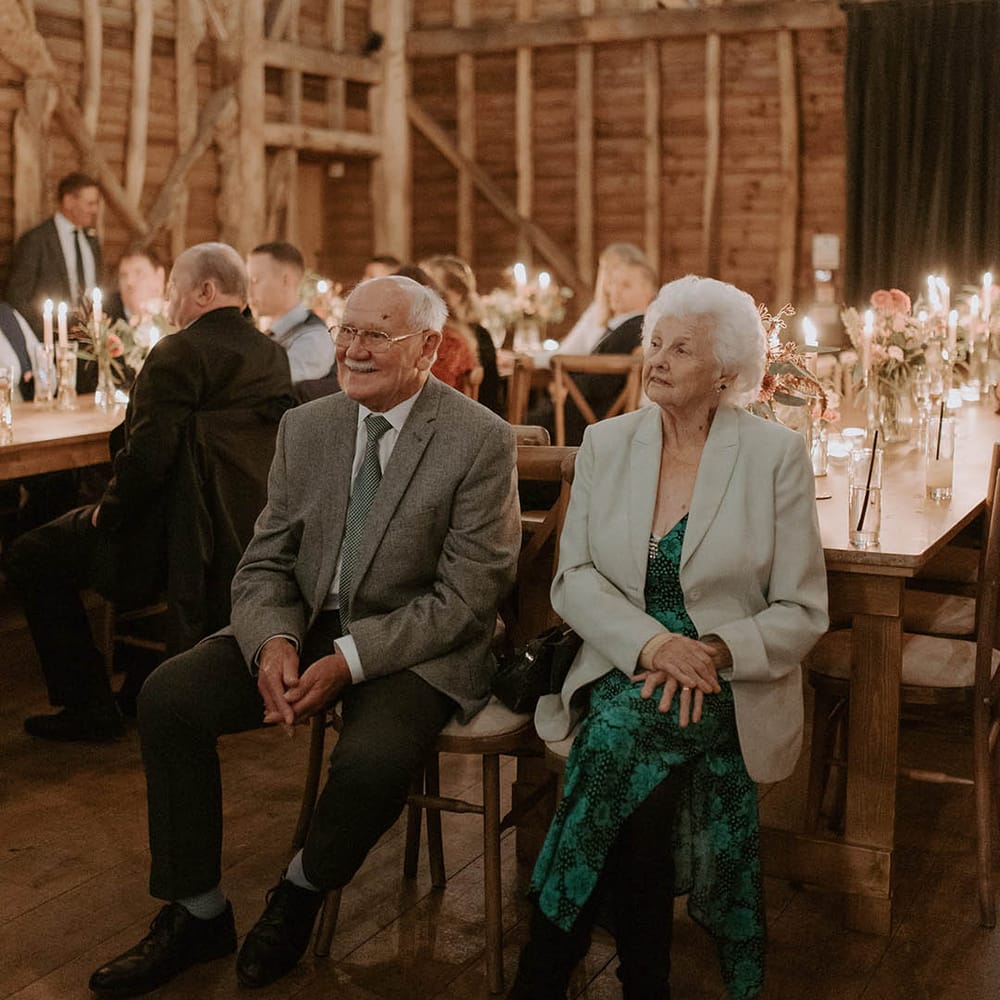 Wedding guests look on at The Barns at Redcoats