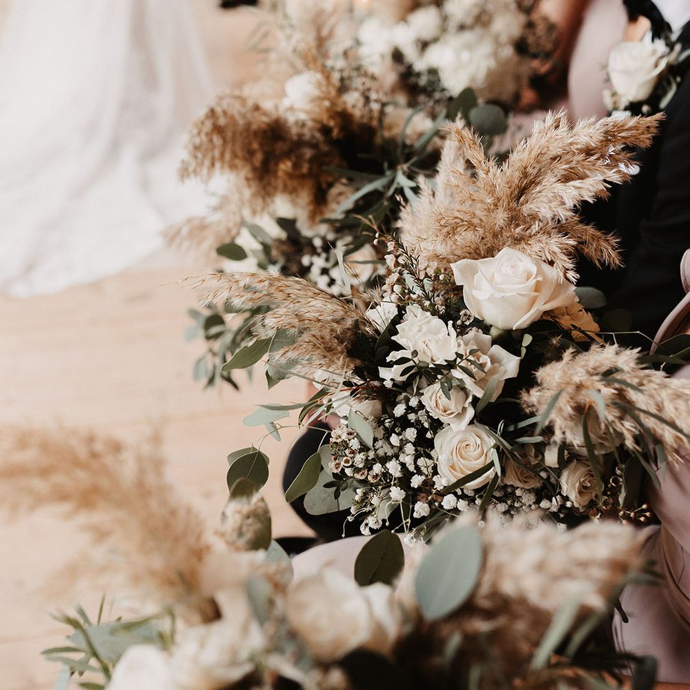 Dried flower and white rose wedding bouquets for winter wedding at Christmas at Hidden River Barn 