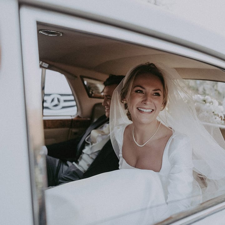 Bride in wedding car arriving at Hedsor House wedding 