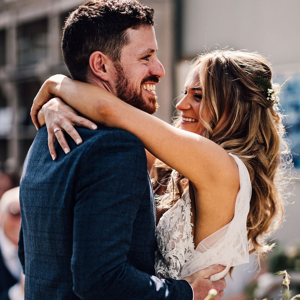 Bride and groom share an embrace 