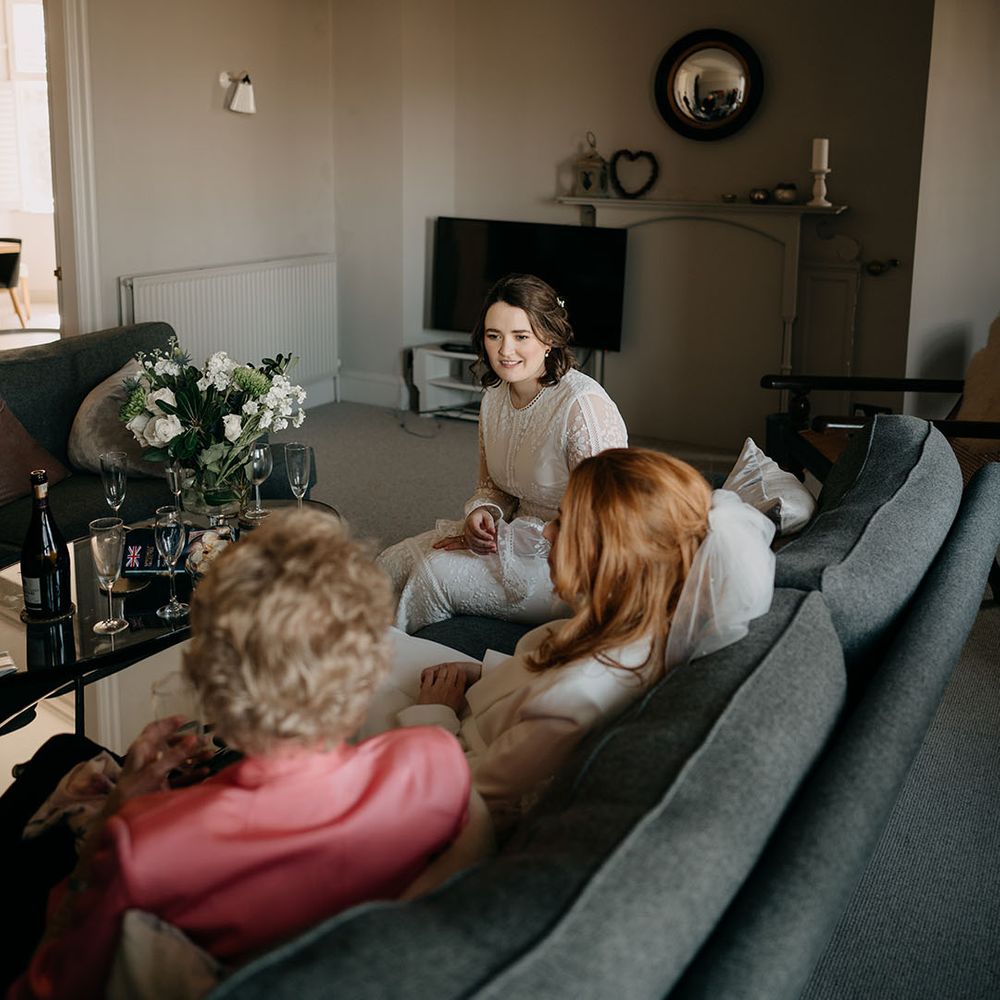 Brides sit together on their wedding day