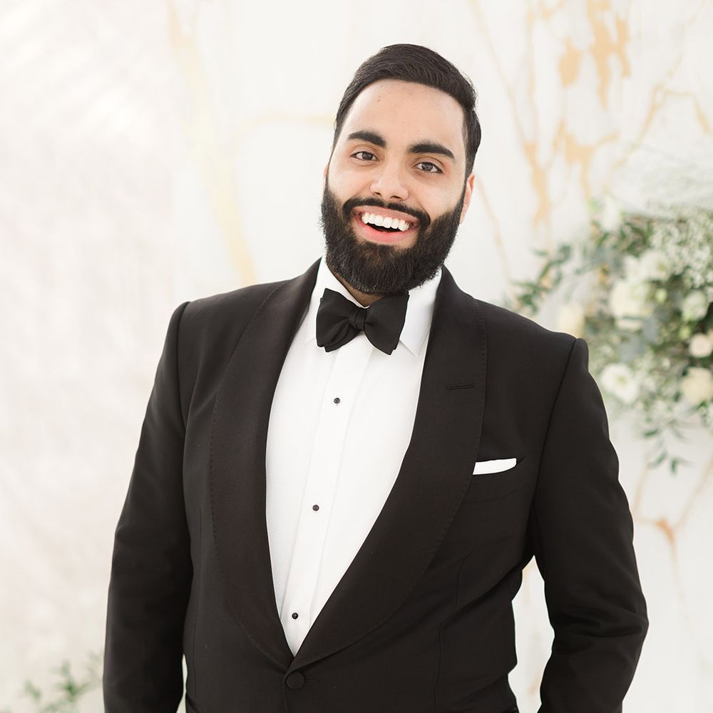 Groom wears black tie for Walima ceremony 