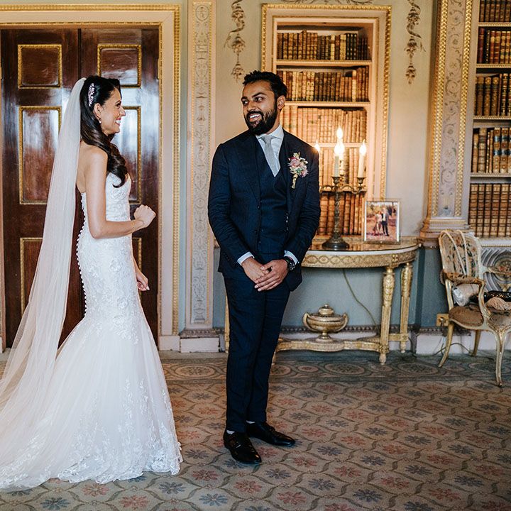 Bride & groom see one another on their wedding day during first look moment at Syon Park 